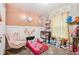Charming ' bedroom with pastel pink walls, decorative accents, and cozy furnishings at 709 S Meridian St, Lebanon, IN 46052