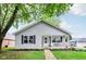 Charming single-story home with a covered front porch and well-maintained lawn and tidy landscaping at 709 S Meridian St, Lebanon, IN 46052