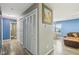 Hallway with closet doors leading to a dining area with modern flooring at 709 S Meridian St, Lebanon, IN 46052