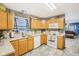 Charming kitchen featuring light wood cabinets, white appliances, and modern flooring at 709 S Meridian St, Lebanon, IN 46052