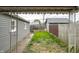 View of a fenced backyard and a firepit, offering a tranquil outdoor space for relaxation and entertainment at 71 S 9Th Ave, Beech Grove, IN 46107