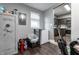 Unfinished basement with various storage items, a utility safe and a partial view into the kitchen at 71 S 9Th Ave, Beech Grove, IN 46107