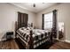 Comfortable bedroom with a large bed, decorative accents, and window with natural light at 71 S 9Th Ave, Beech Grove, IN 46107