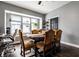 Charming dining room with a classic table, plush chairs, and a large window with natural light at 71 S 9Th Ave, Beech Grove, IN 46107