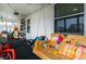 Sunroom with hanging swing, indoor/outdoor carpet and plenty of natural light at 71 S 9Th Ave, Beech Grove, IN 46107