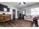 Inviting living room featuring hardwood floors, gray walls, a ceiling fan and natural light at 71 S 9Th Ave, Beech Grove, IN 46107