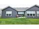 Backyard with an inviting patio and seating area, perfect for outdoor living at 7141 Lillian Pl, Cumberland, IN 46229