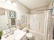 Well-lit bathroom with a shower-tub combo and a decorative vanity mirror at 7141 Lillian Pl, Cumberland, IN 46229