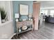 Inviting foyer with a stylish console table, attractive decor, and views of the open-concept living area at 7141 Lillian Pl, Cumberland, IN 46229