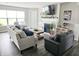 Bright living room featuring fireplace, comfortable seating, and stylish decor, creating an inviting atmosphere at 7141 Lillian Pl, Cumberland, IN 46229