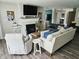 Spacious living room with fireplace, comfortable seating arrangements, and ample natural light at 7141 Lillian Pl, Cumberland, IN 46229