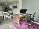 Office space featuring a rustic wood desk with views into the adjacent eat-in kitchen at 7141 Lillian Pl, Cumberland, IN 46229