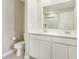 Bright bathroom features dual sinks with white cabinets and a large mirror at 7277 Governors Row, Avon, IN 46123