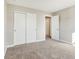 Bedroom featuring sliding closet doors and neutral carpet at 7277 Governors Row, Avon, IN 46123