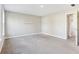 Bedroom with neutral carpet, floating shelves, and a glimpse into the hallway at 7277 Governors Row, Avon, IN 46123