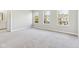 Large, brightly lit primary bedroom with three windows and ensuite bathroom at 7277 Governors Row, Avon, IN 46123
