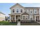 Charming two-story home with mixed siding, a covered porch, and a well-manicured front lawn at 7277 Governors Row, Avon, IN 46123