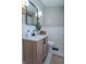 Cozy bathroom featuring a marble countertop vanity with black hardware, modern lighting, and neutral finishes at 7561 N Hall School Rd, Monrovia, IN 46157
