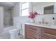 Elegant bathroom with modern vanity, gold fixtures, and tiled shower-tub combo at 7561 N Hall School Rd, Monrovia, IN 46157