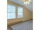 Bright bedroom with a ceiling fan, two windows, and patterned carpet at 7561 N Hall School Rd, Monrovia, IN 46157