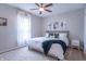 Charming bedroom features a plush bed, decorative pillows and a ceiling fan at 7561 N Hall School Rd, Monrovia, IN 46157