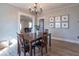 A pleasant dining room featuring a wood table, modern flooring, decor and a view into the living room at 7561 N Hall School Rd, Monrovia, IN 46157