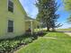 Side view of a yellow two-story home featuring a covered front porch with swing at 7561 N Hall School Rd, Monrovia, IN 46157