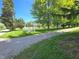 View of a gravel driveway leading to a yard with a white picket fence at 7561 N Hall School Rd, Monrovia, IN 46157