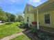Side view of a yellow two-story home featuring a covered front porch with swing at 7561 N Hall School Rd, Monrovia, IN 46157