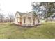 Charming two-story home featuring a welcoming front porch with a porch swing and spacious front yard at 7561 N Hall School Rd, Monrovia, IN 46157