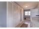 Hallway features large closets with louvered doors and natural light at 7561 N Hall School Rd, Monrovia, IN 46157