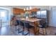 Spacious kitchen featuring stainless steel appliances, an island with seating for four, and a large basin sink at 7561 N Hall School Rd, Monrovia, IN 46157