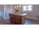 Kitchen island features stylish butcher block top, storage cabinets and modern pendant lighting at 7561 N Hall School Rd, Monrovia, IN 46157