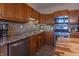 Kitchen featuring wood cabinets, stainless steel appliances, and stylish backsplash at 7561 N Hall School Rd, Monrovia, IN 46157