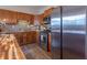 Kitchen featuring wood cabinets, stainless steel appliances, and butcher block island at 7561 N Hall School Rd, Monrovia, IN 46157