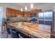 Bright kitchen with wood cabinets, mosaic backsplash, and stainless steel appliances at 7561 N Hall School Rd, Monrovia, IN 46157
