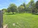 Beautifully maintained front yard featuring mature trees, offering a serene and inviting atmosphere at 7561 N Hall School Rd, Monrovia, IN 46157