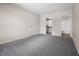 Spacious bedroom features neutral tones, carpet flooring, a walk-in closet and an attached bathroom at 7652 Wood Stream Dr, Indianapolis, IN 46239