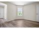 Bedroom features neutral walls and flooring, a window for natural light, and ample space at 7652 Wood Stream Dr, Indianapolis, IN 46239