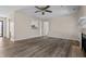 The living room features new flooring and a view into the kitchen and other rooms at 7652 Wood Stream Dr, Indianapolis, IN 46239