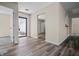 Open-concept area with new flooring, neutral walls and a view to the backyard at 7652 Wood Stream Dr, Indianapolis, IN 46239