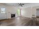 Bright living room features a cozy fireplace and new wood-look flooring throughout at 7652 Wood Stream Dr, Indianapolis, IN 46239