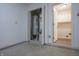A utility room with a water heater and storage space, adjacent to the laundry room at 7652 Wood Stream Dr, Indianapolis, IN 46239