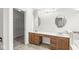 Spacious bathroom with dual sinks, walk-in closet, and granite countertops at 769 Raintree Dr, Avon, IN 46123