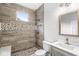 Beautifully tiled bathroom with walk-in shower, mosaic accents, and vanity at 769 Raintree Dr, Avon, IN 46123