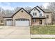 Stunning brick two-story home with attached two car garage and well-maintained lawn at 769 Raintree Dr, Avon, IN 46123