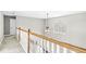 Bright hallway with white railing and window bringing in natural light at 769 Raintree Dr, Avon, IN 46123