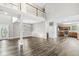 Bright open-concept living room with modern chandelier and high ceilings next to kitchen at 769 Raintree Dr, Avon, IN 46123