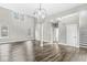 Open concept living room featuring modern lighting and a staircase leading to the second floor at 769 Raintree Dr, Avon, IN 46123