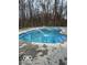 Sparkling in-ground pool with refreshing water feature and ample space for swimming at 769 Raintree Dr, Avon, IN 46123